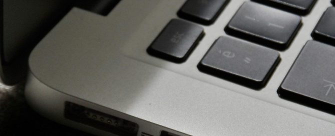Free Detailed view of a silver laptop showing keyboard and multiple ports. Stock Photo